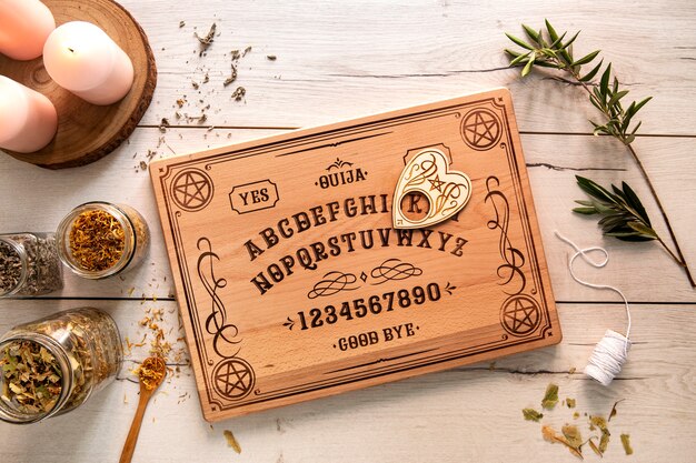 Free photo top view ouija board and candles