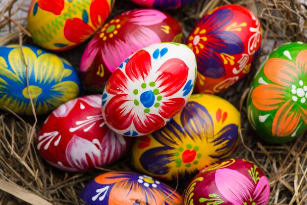 Top view of painted easter eggs on a nest