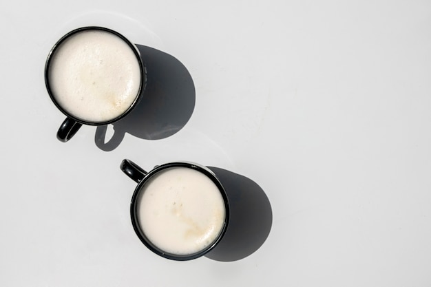 Top view pair of cups of coffee