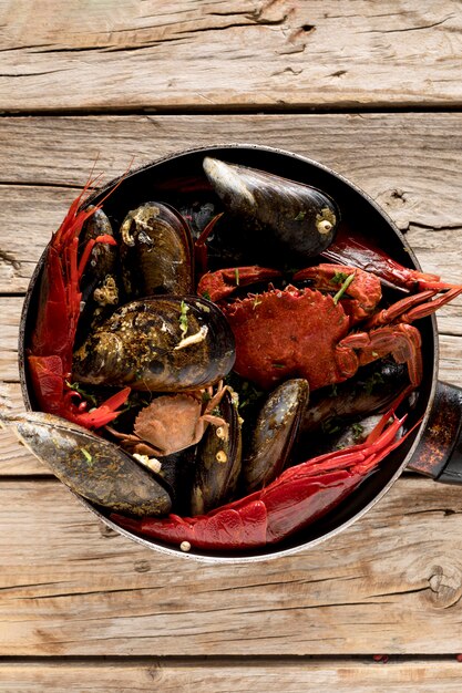 Top view of pan with crab and mussels