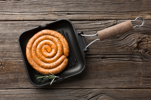 Top view pan with delicious grill sausage