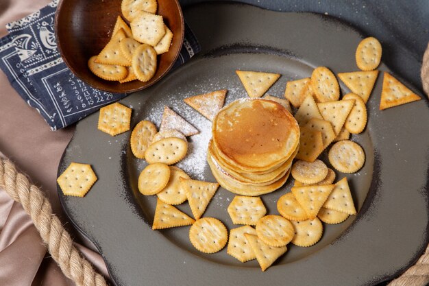 Top view pancakes and crackers on the plate background food meal breakfast sweet cracker