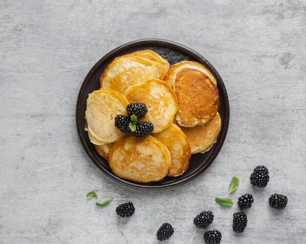 Top view pancakes with blackberries