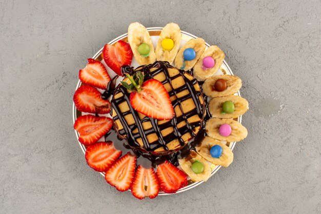 top view pancakes yummy sweet delicious with fresh fruits and chocolate on grey