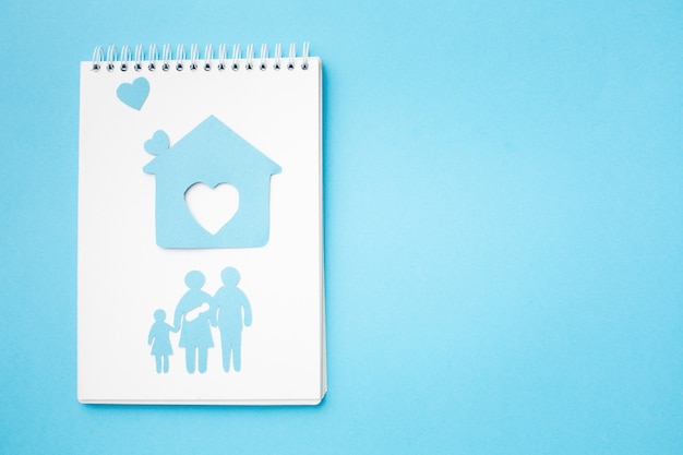 Free photo top view paper cut family and home with copy space