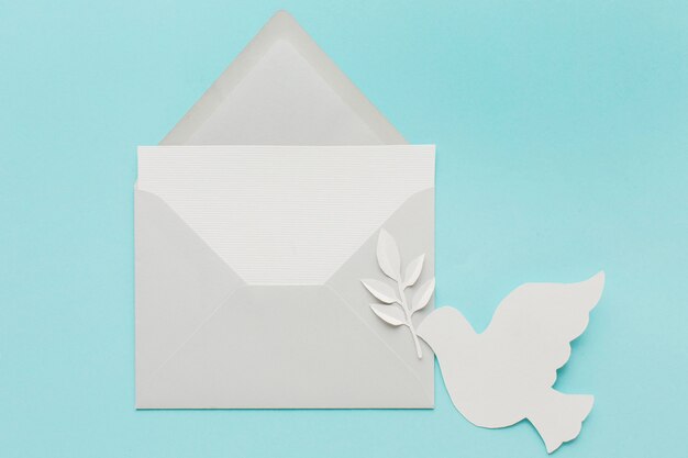 Top view of paper dove with envelope