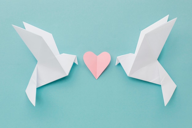 Top view of paper doves with heart