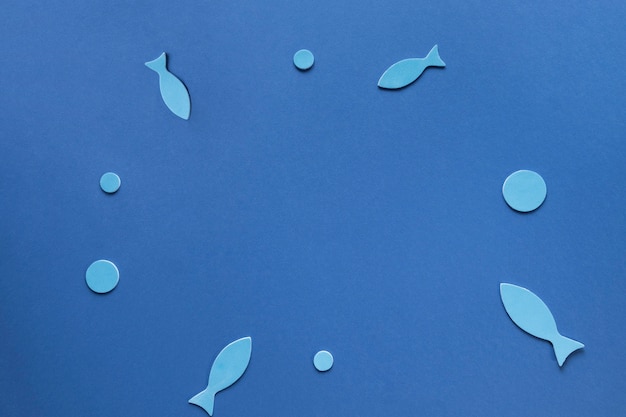 Free photo top view of paper fish with circles