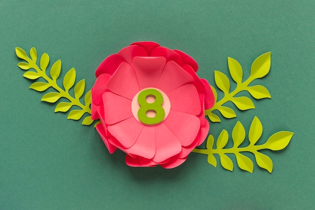 Free photo top view of paper flowers with date for women's day