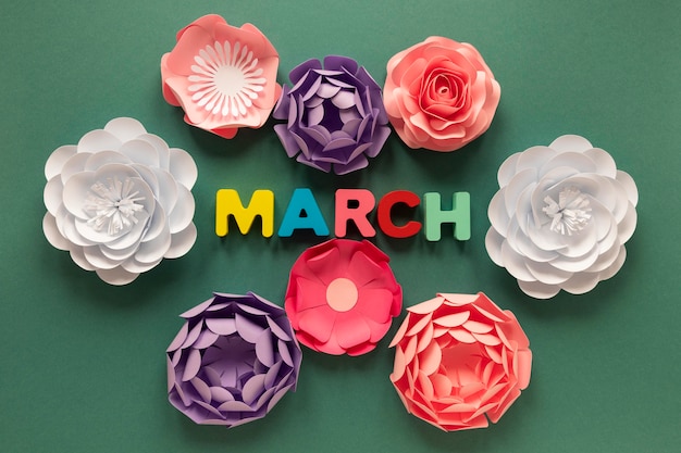 Free photo top view of paper flowers with month for women's day