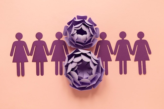 Top view of paper flowers and women for women's day