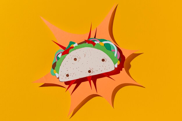 Top view paper taco on yellow background