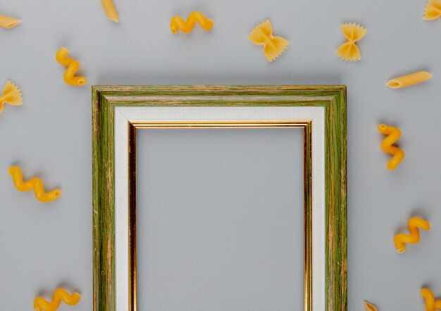 Top view of pasta around an empty frame