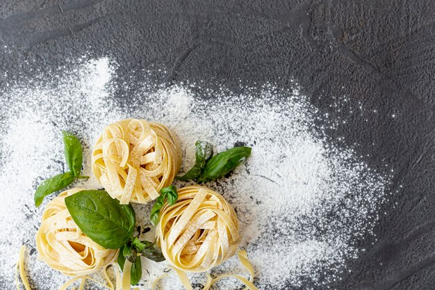 Top view of pasta arrangement with flour