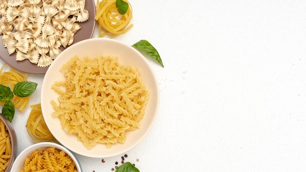 Free photo top view of pasta in bowls with copy space