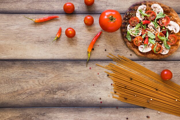 Top view pasta and vegetables with copy space