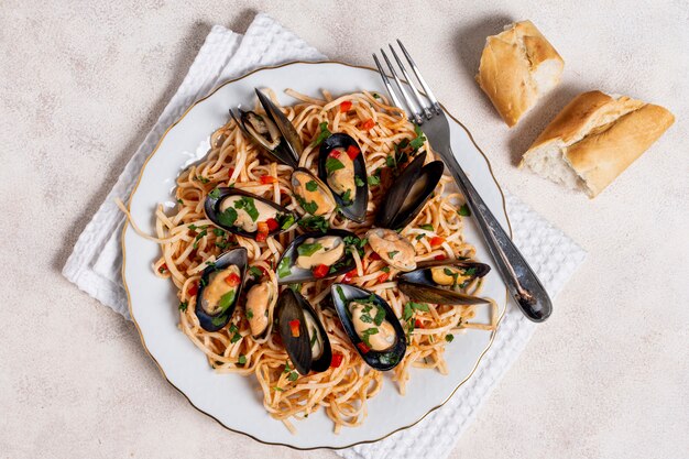 Top view pasta with mussels on a plate