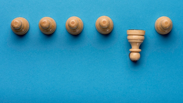 Free photo top view of pawns with copy space