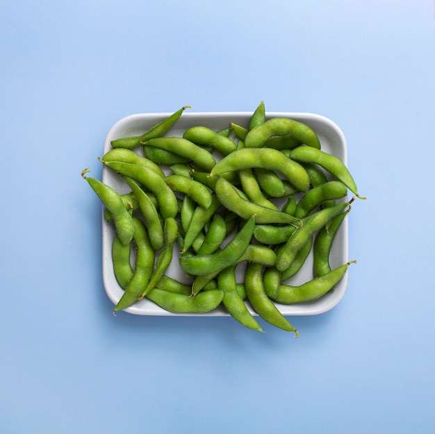 Top view pea pods on plate