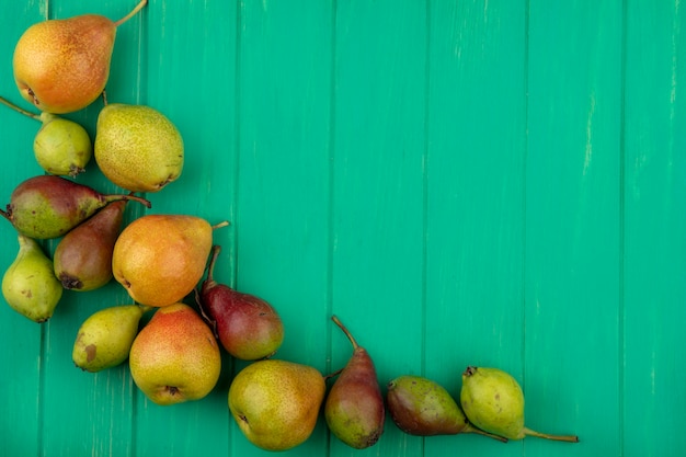 Top view of peaches on green surface