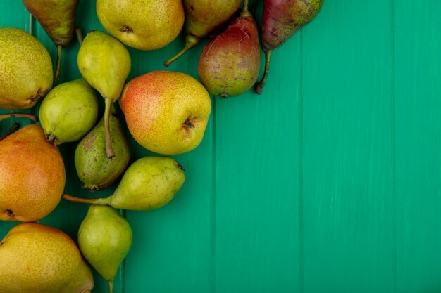 Top view of peaches on green surface