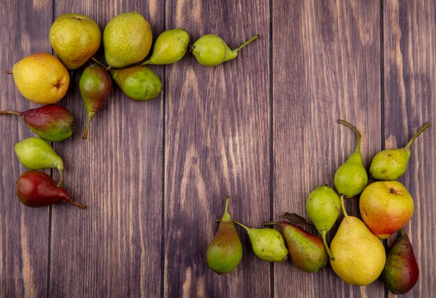 Top view of peaches on wooden surface