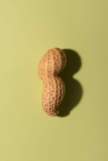 Free photo top view peanut on green background