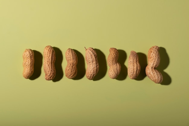 Top view peanuts on green background