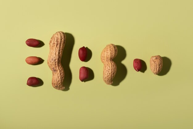 Top view peanuts on green background