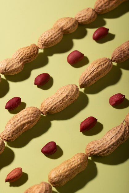 Top view peanuts on green background