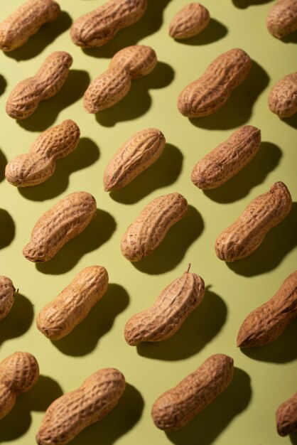 Top view peanuts on green background