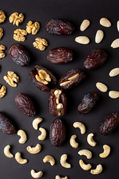 A top view peanuts xurma brown isolated on the dark floor