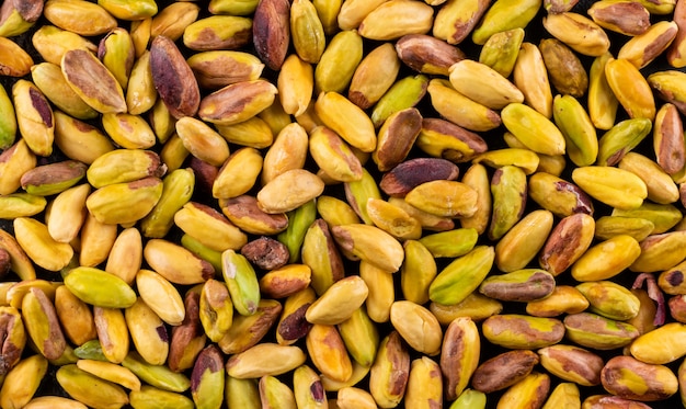 Free photo top view peeled pistachios texture  horizontal