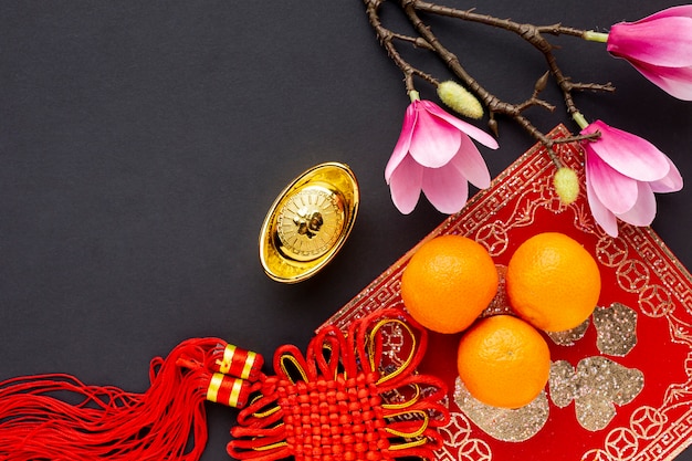 Top view of pendant and tangerines chinese new year