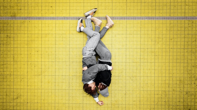 Free photo top view people hugging on an illuminating floor