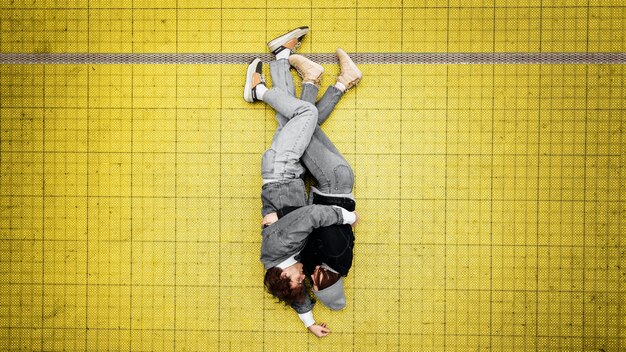 Top view people hugging on an illuminating floor