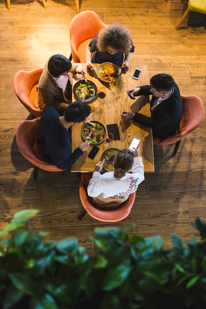 Top view of people at table in restaurant