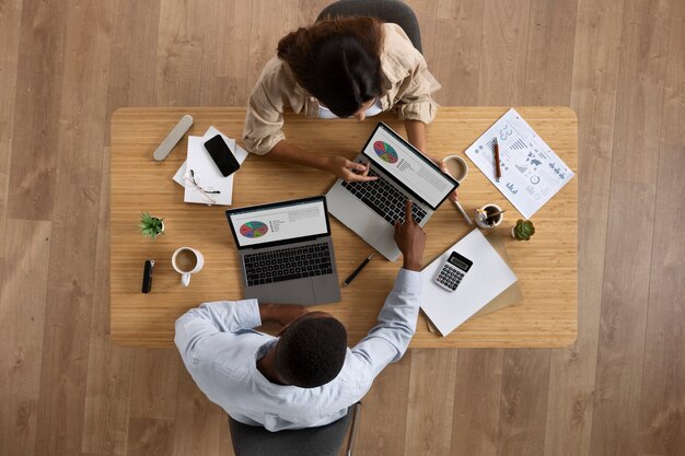 Top view people working at desk