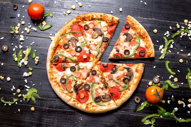 Top view of pepperoni pizza sliced into six slices