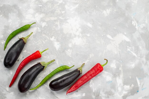 Top view peppers and eggplants ripe and isolated on the white background vegetbale food raw dish