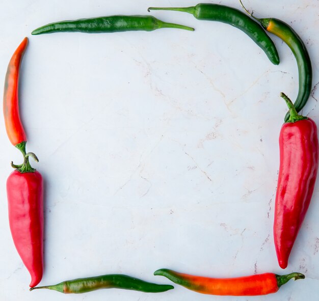 Free photo top view of peppers set in square shape on white background with copy space