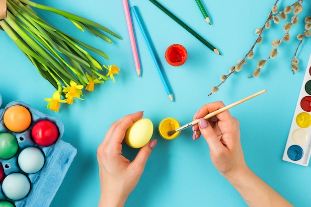 Free photo top view of person painting easter eggs