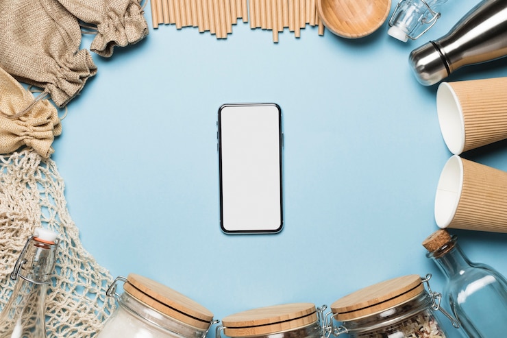 Free Photo top view phone mock-up with eco friendly objects