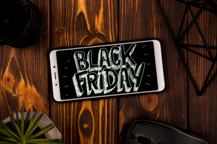 Free Photo top view of phone with black friday message