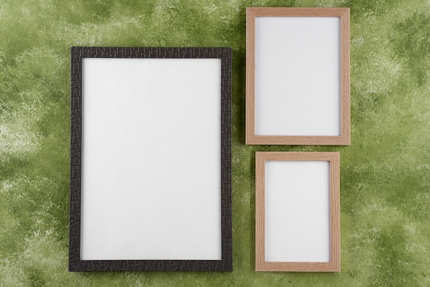 Top view of photo frames on textured surface
