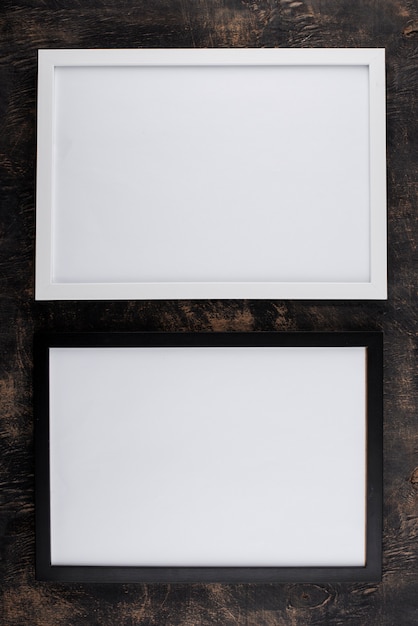 Top view of photo frames on textured surface