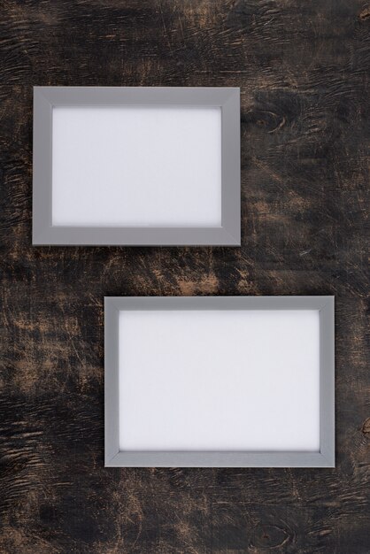 Top view of photo frames on textured surface