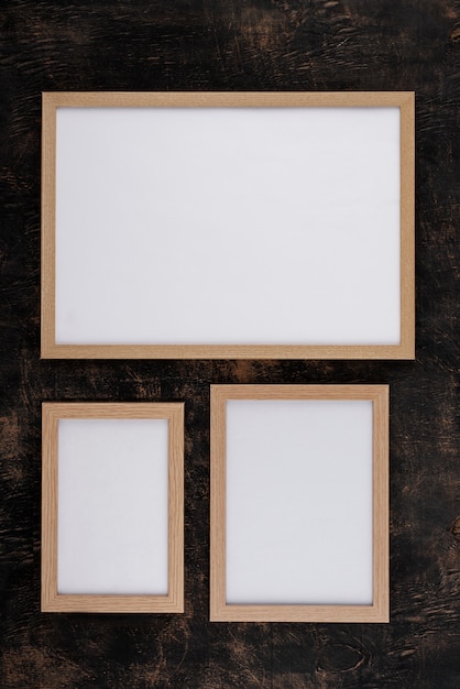 Top view of photo frames on textured surface