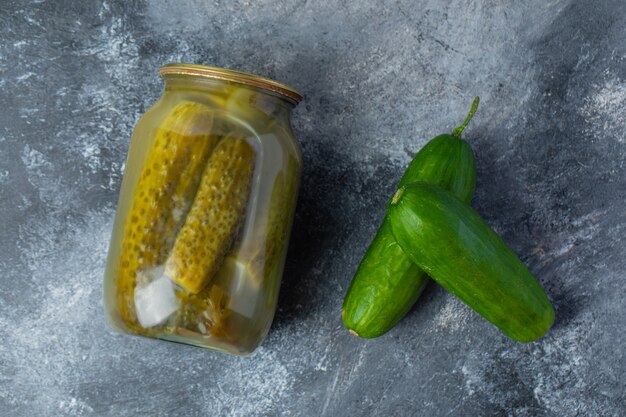 Top view of pickled and fresh cucumber. 