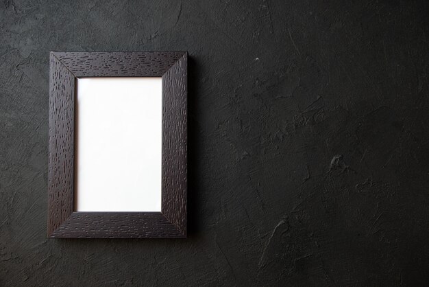 Top view of picture frame on a dark wall